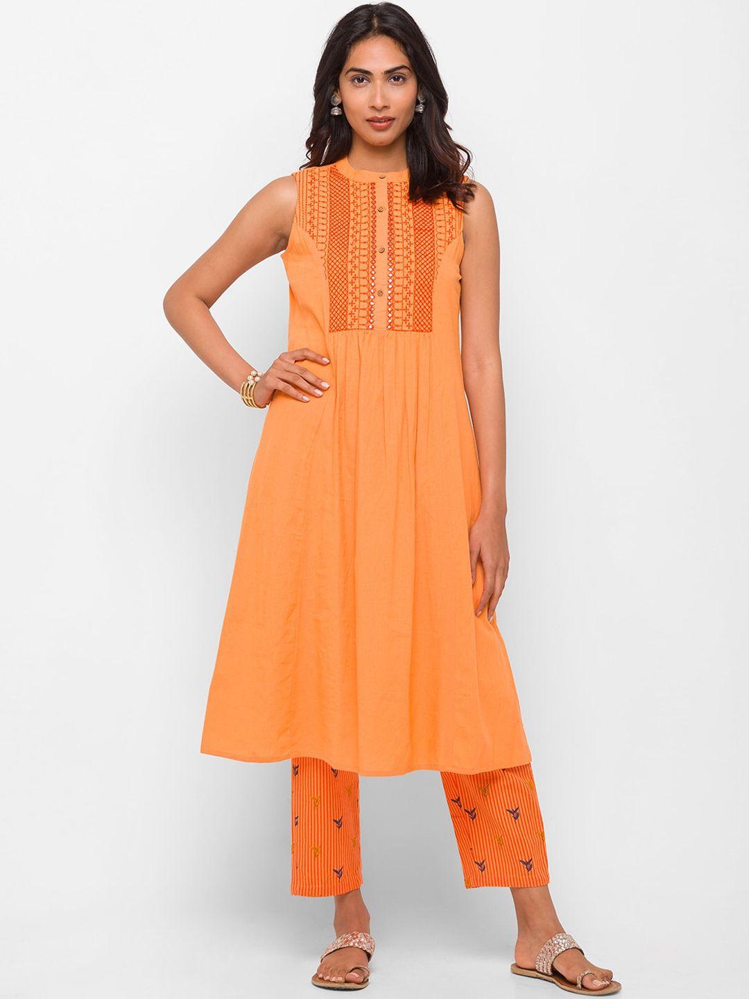 globus women orange pleated mirror work pure cotton kurti with trousers