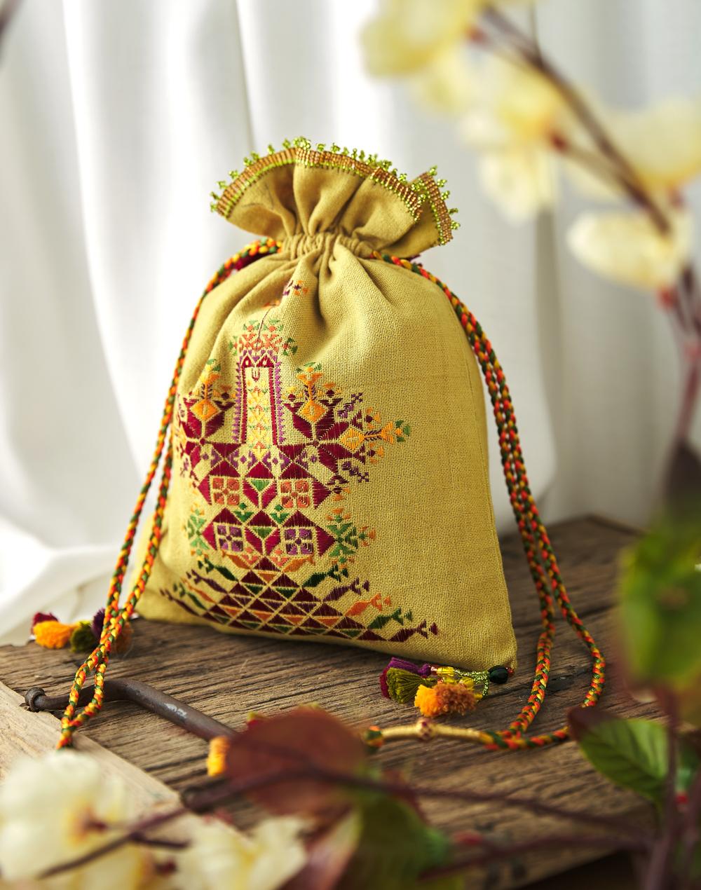 green hand embroidery potli bag