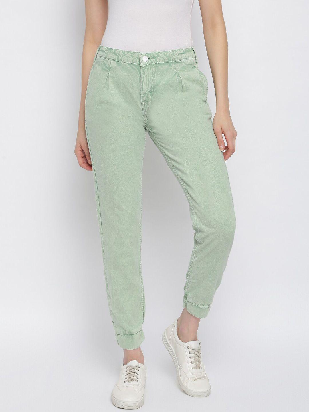 tales & stories women green solid slouchy fit trousers