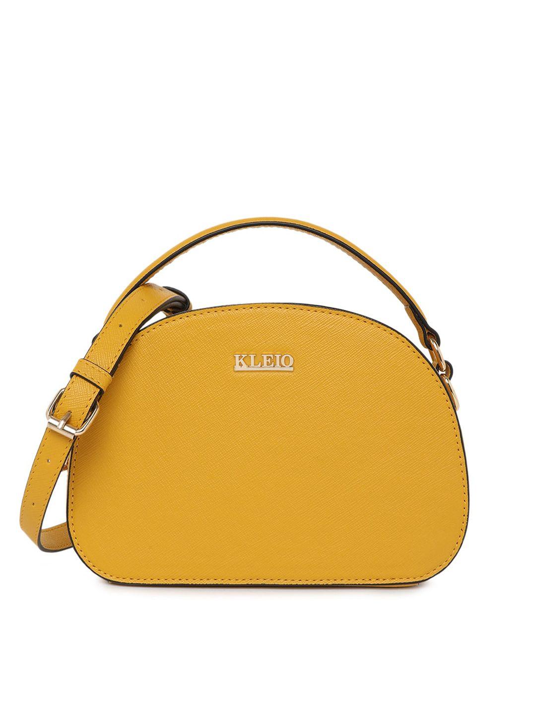 kleio mustard yellow saffiano textured half moon handheld bag with detachable sling strap