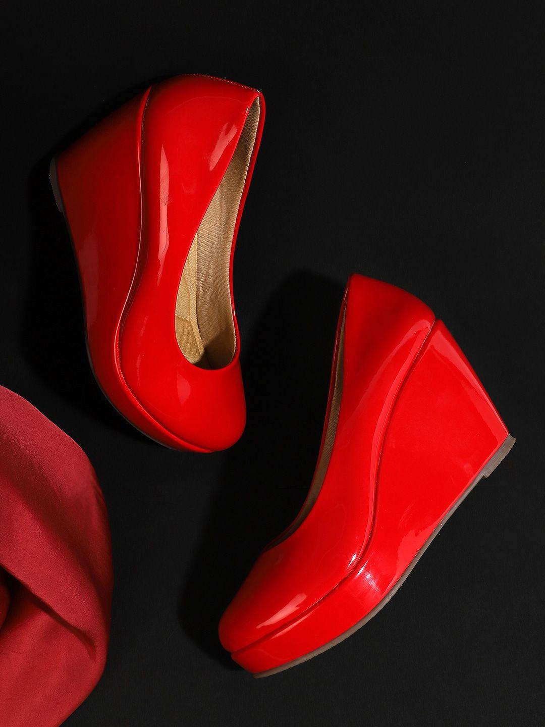 iconics red wedge pumps