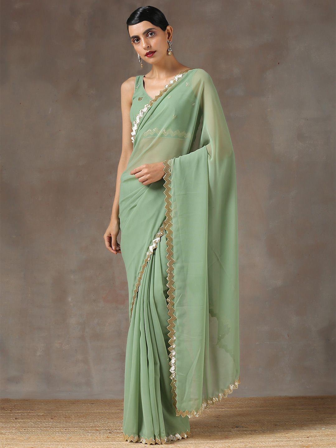 swtantra green & golden pure georgette saree