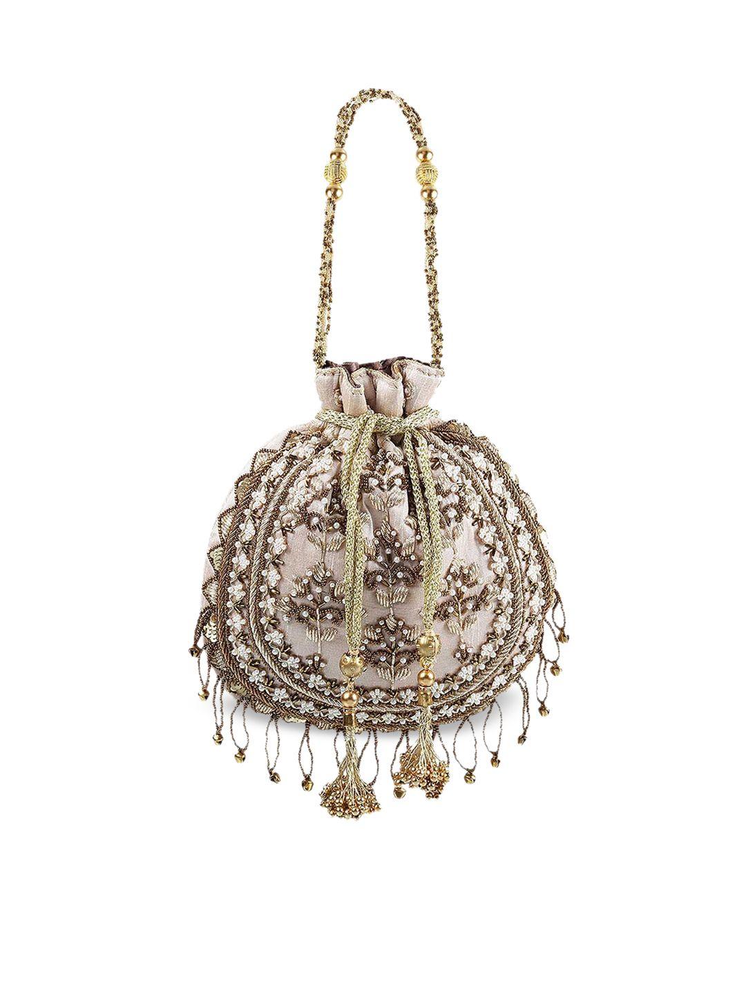 mochi beige bucket handheld bag with tasselled