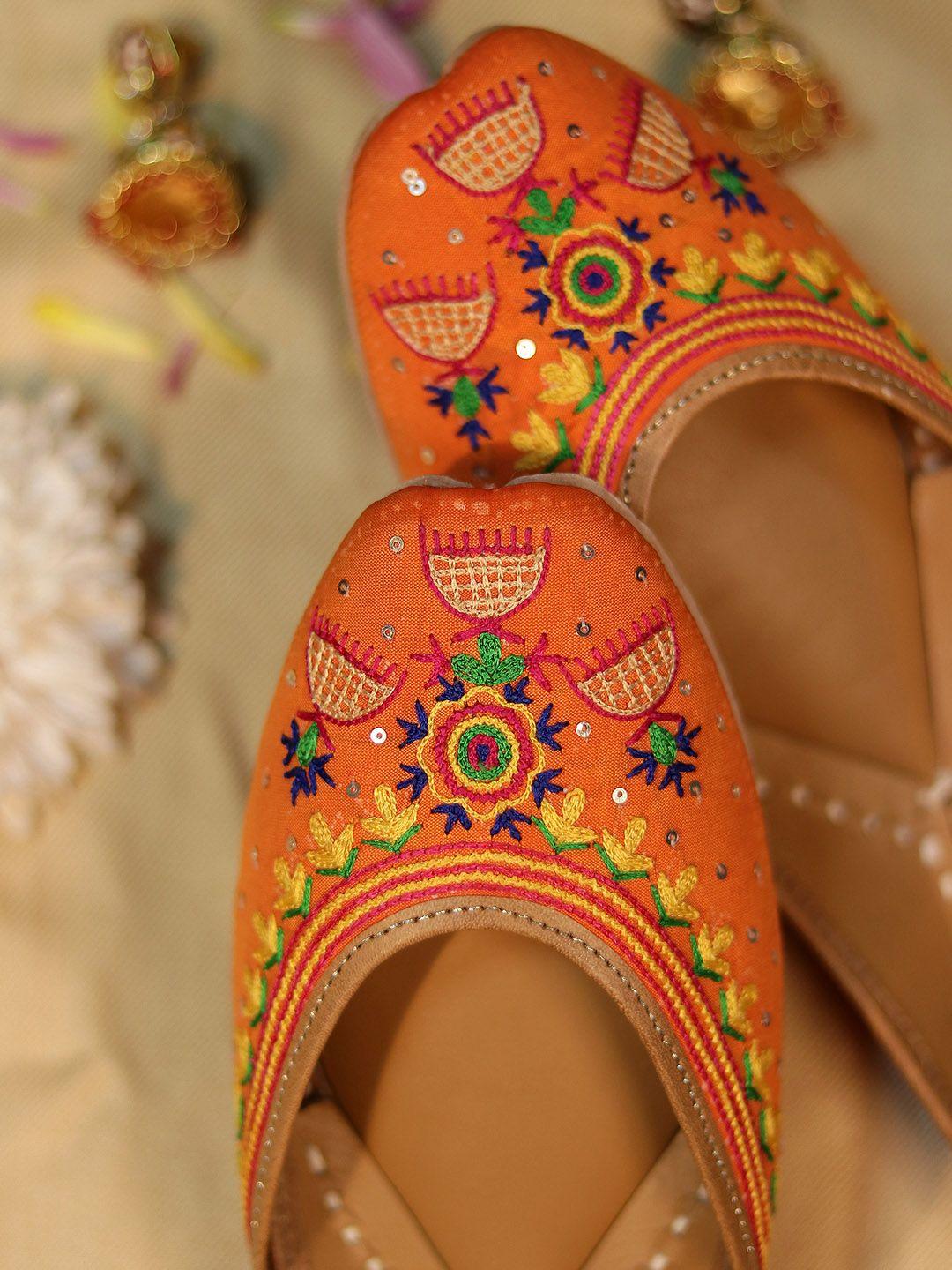 glam story women orange embellished ethnic mojaris with embroidered flats