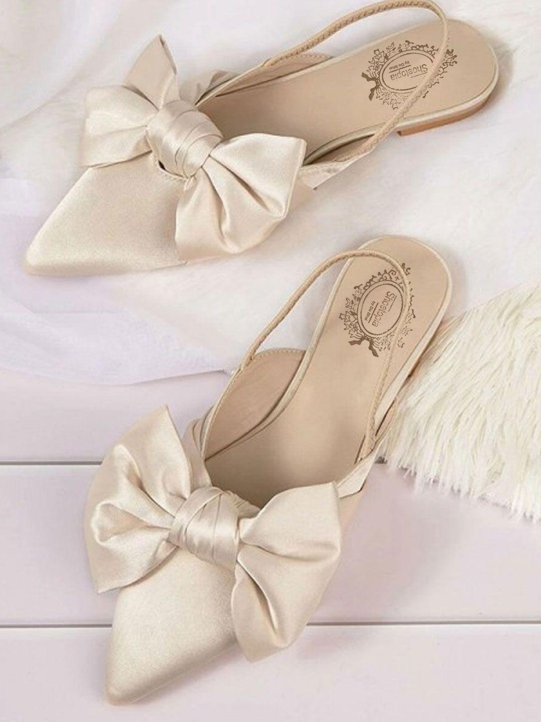 shoetopia women cream-coloured printed ballerinas with bows