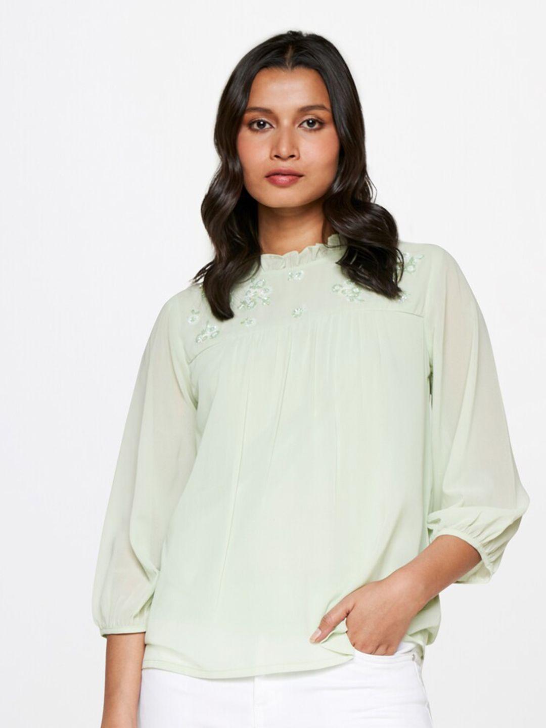 and embellished high neck puff sleeves top