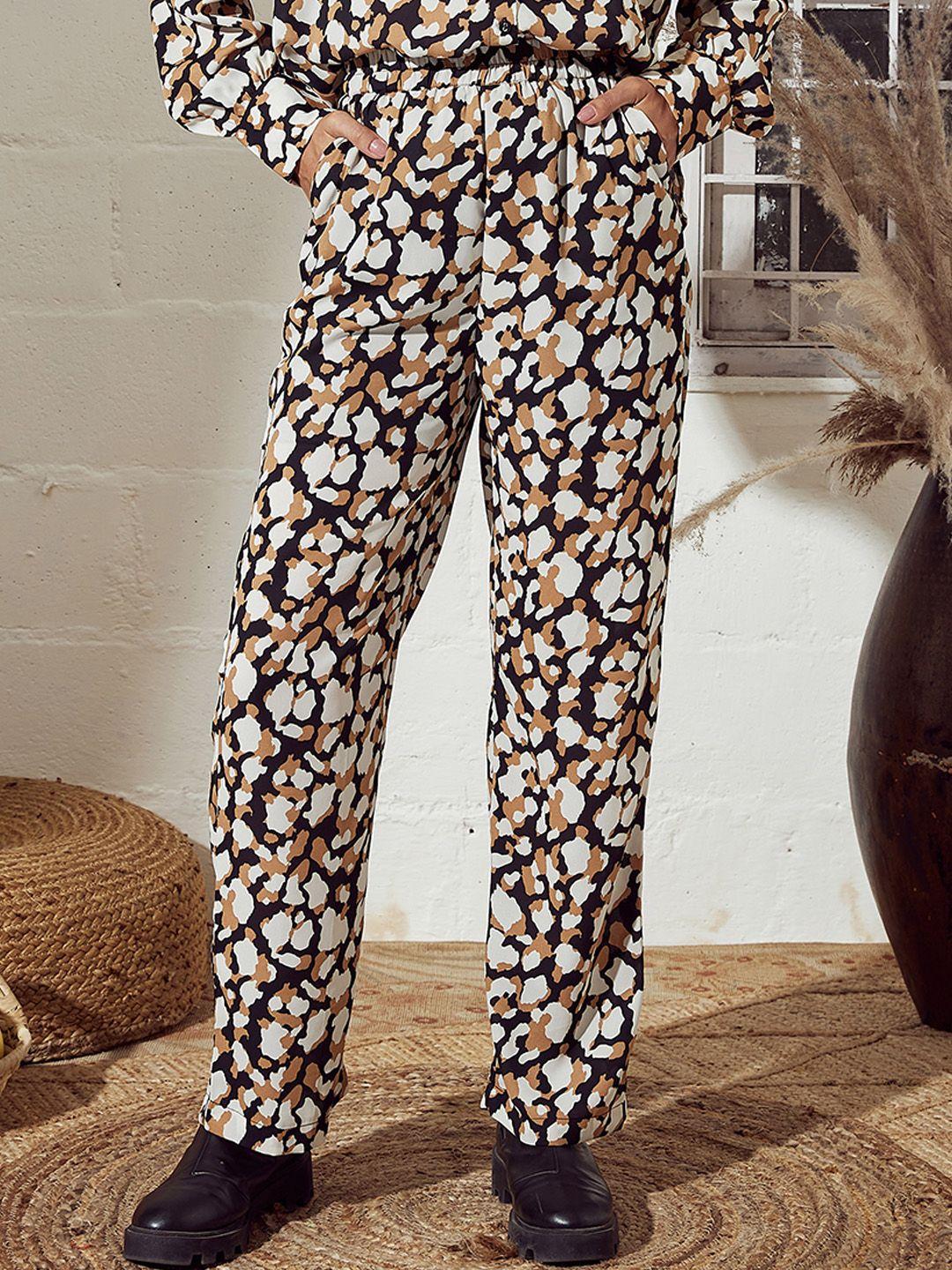 sassafras women beige animal printed trousers