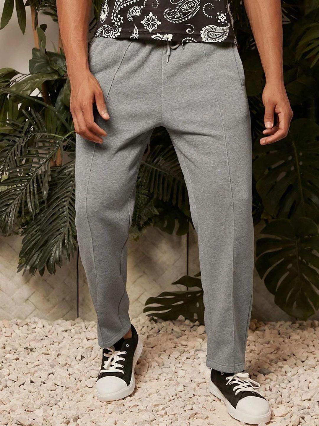 kotty men solid mid-rise track pants