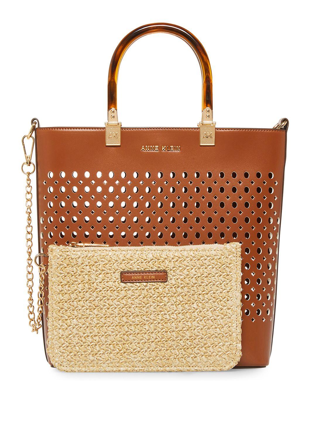 anne klein geometric textured structured handheld bag with cut work detail