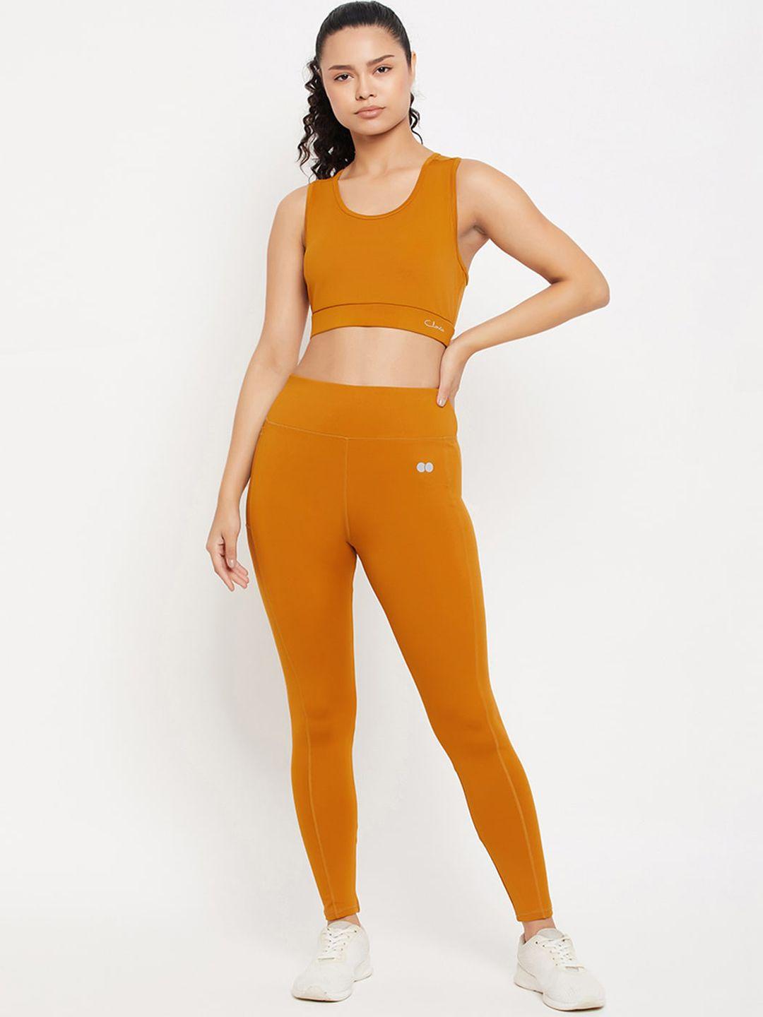 clovia sleeveless padded sports bra & high-rise active tights tracksuits