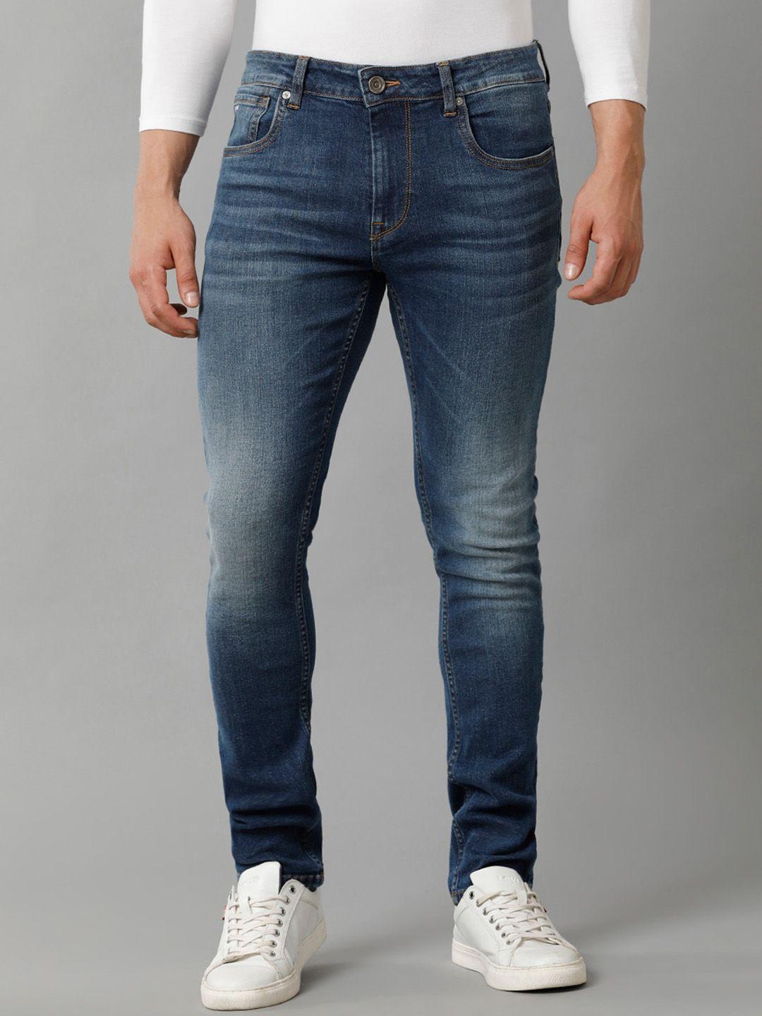 voi jeans men skinny fit whiskers & chevrons light fade stretchable jeans