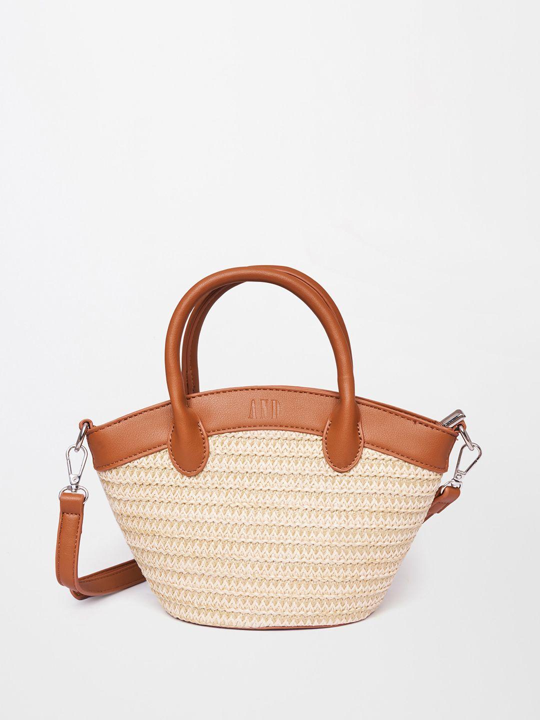 and textured structured handheld bag with tasselled