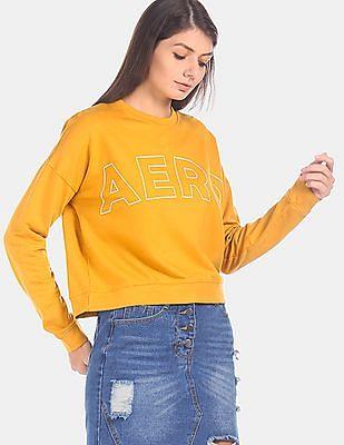 women mustard crew neck brand print sweatshirt