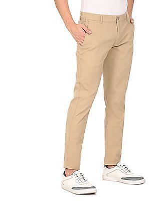 men light khaki mid rise solid casual trousers