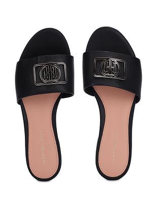 women black metallic logo accent leather sandals