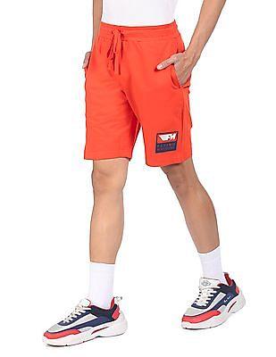 men orange mid rise solid shorts