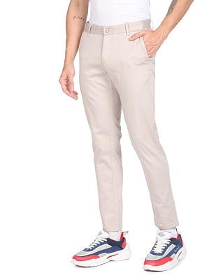 men beige super slim fit solid casual trousers