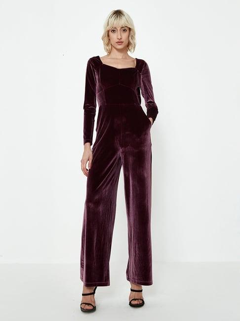 cover story purple jumpsuit