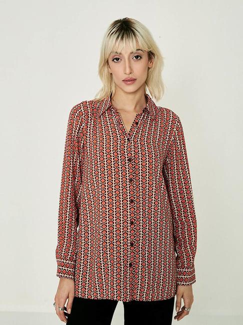 cover story red geometric print shirt