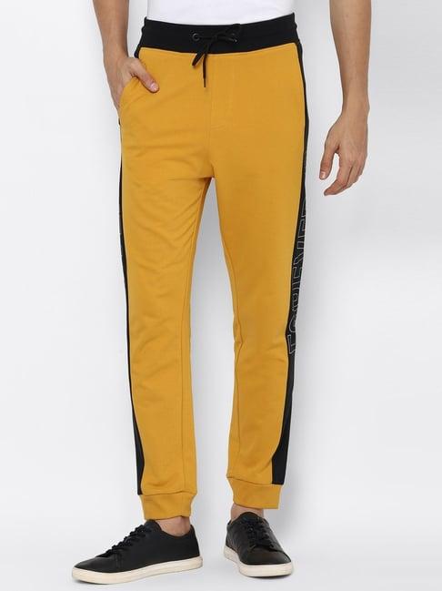 forever 21 yellow regular fit color - block joggers