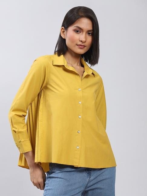 label ritu kumar mustard shirt