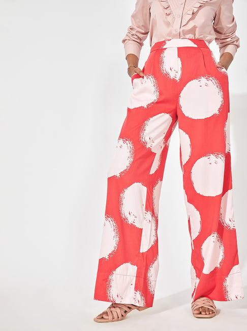 the label life red & white printed flared pants