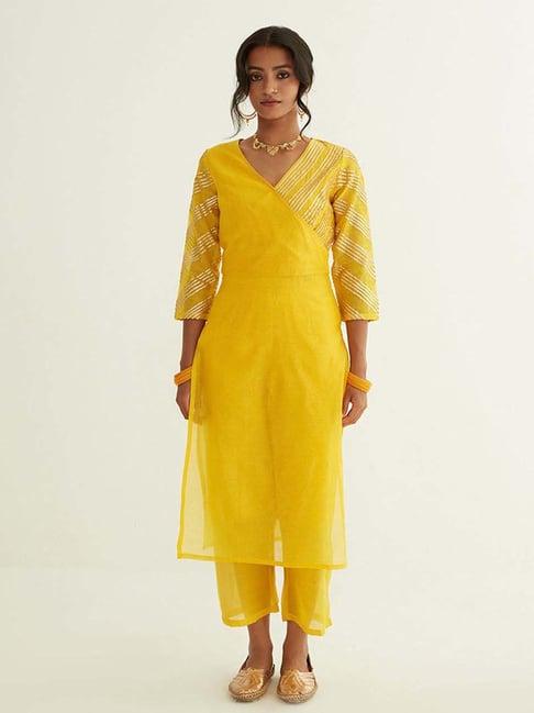 abhishti yellow striped kurta pant set