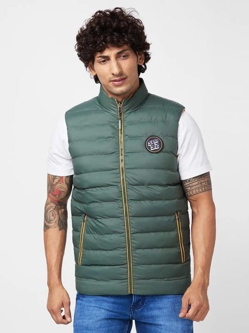 spykar olive green sleeveless reversible jacket with diy velcro badge