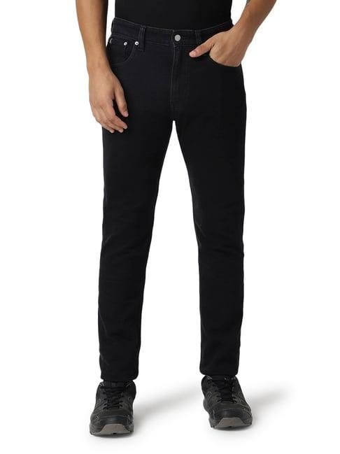 calvin klein jeans tapered fit washed black jeans