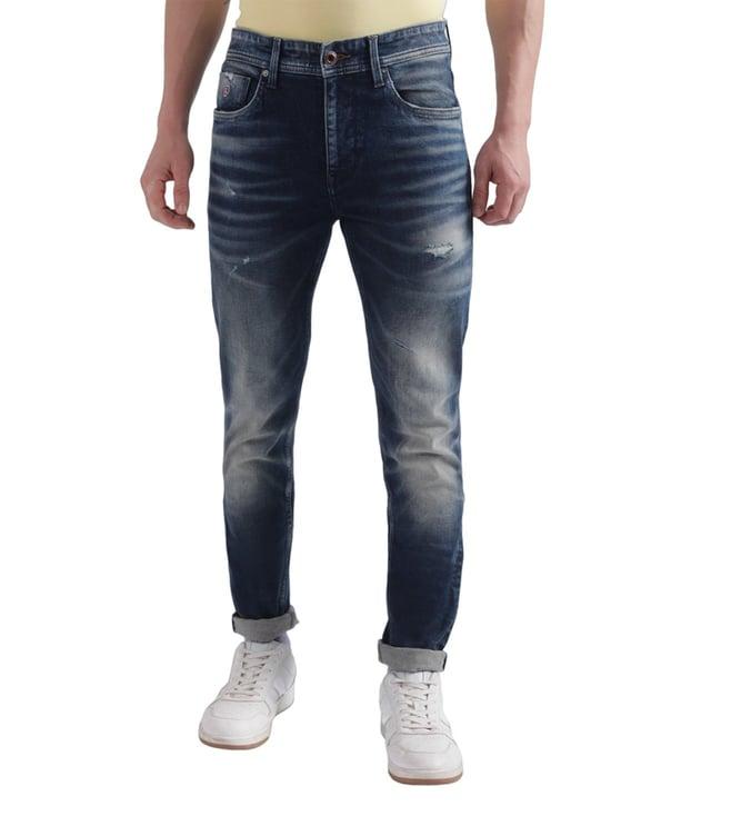 iconic slim tapered blue light distressed mid rise jeans