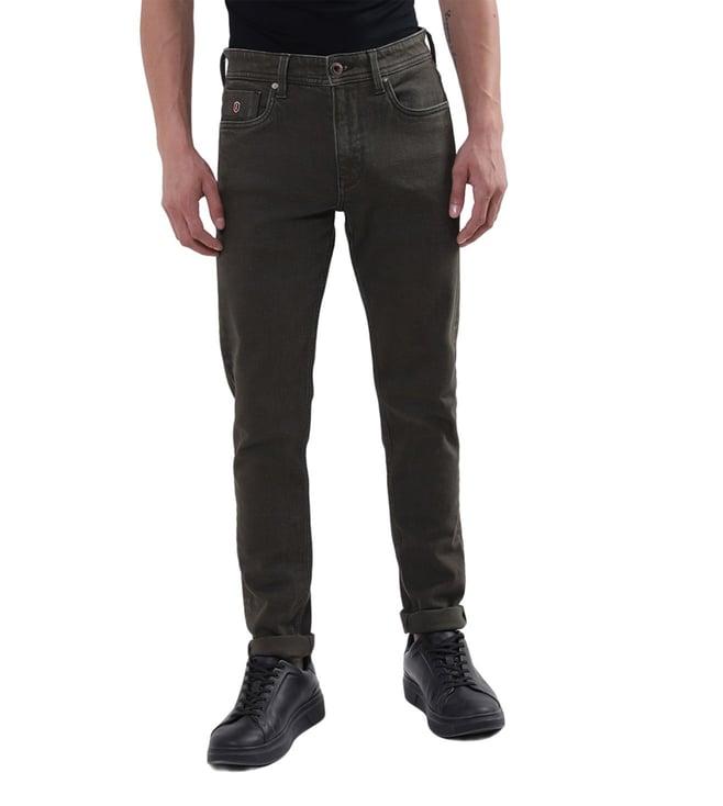 iconic slim tapered olive wahshed mid rise jeans