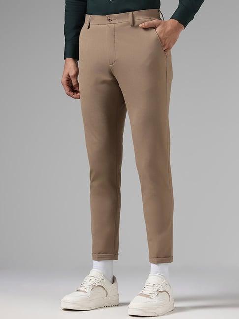 wes formals by westside solid dark khaki carrot fit trousers