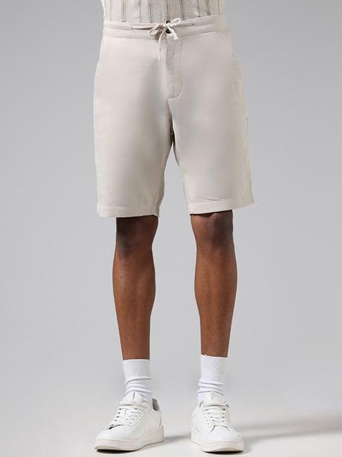 eta by westside solid beige slim fit shorts