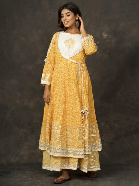 zolo label mustard cotton zari work kurta skirt set with potli