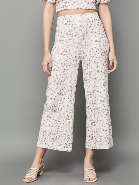 ginger by lifestyle white printed mid rise flared pants