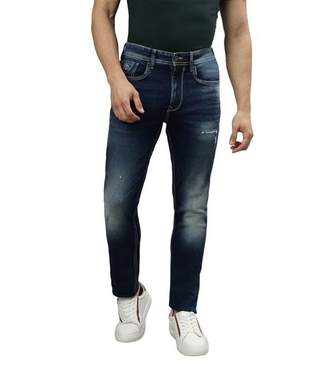 iconic bootcut fit dark blue heavily washed mid rise jeans