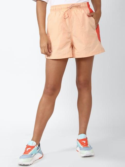 reebok peach logo print sports shorts