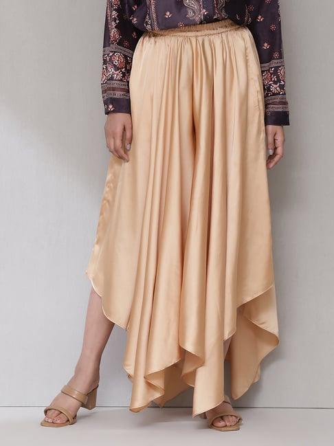 aarke ritu kumar beige loose fit mid rise palazzos