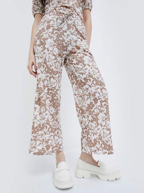 ginger by lifestyle beige printed flared pants