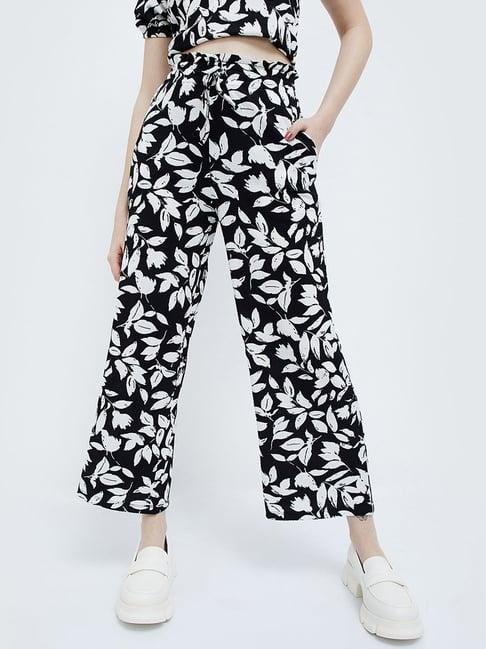 ginger by lifestyle black printed flared pants