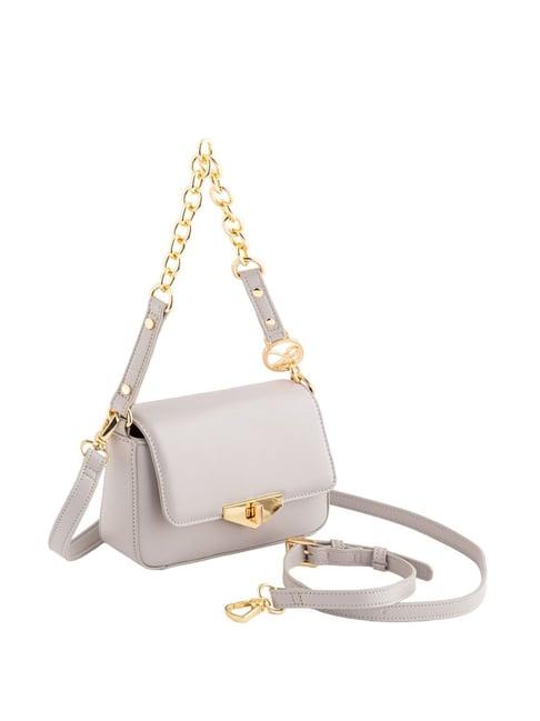 carpisa grace pearl faux leather solid sling handbag