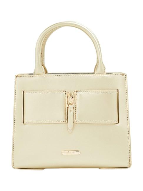 ginger by lifestyle golden handbag