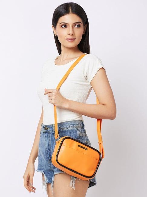 caprese orange solid medium sling handbag