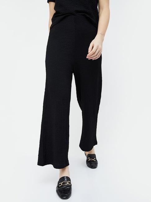 code by lifestyle black textured pants