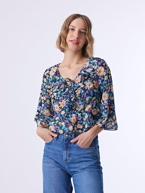 cover story black & blue floral print top