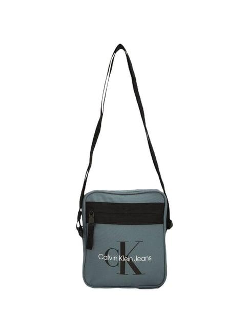 calvin klein goblin blue sport essentials reporter medium cross body bag