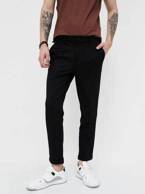 forca by lifestyle black regular fit flat front trousers