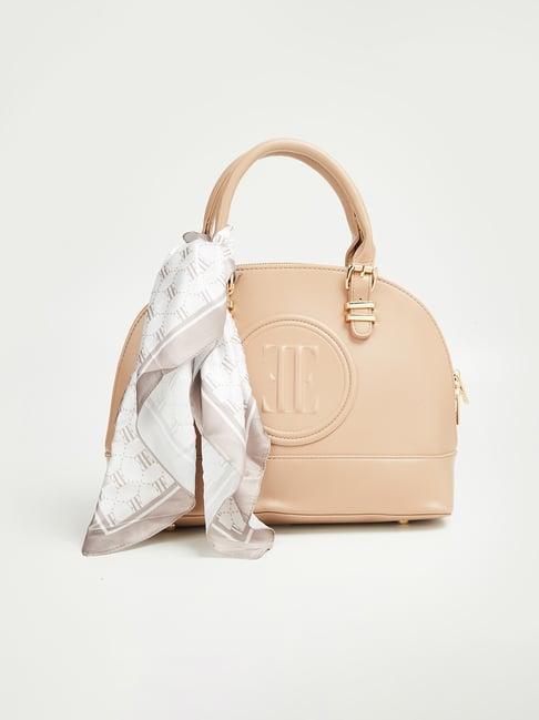 elle beige solid handbag