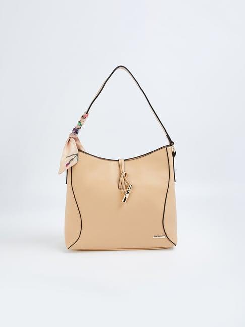 ginger by lifestyle beige solid shoulder handbag