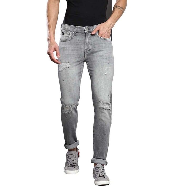 calvin klein light grey dstr mid rise jeans